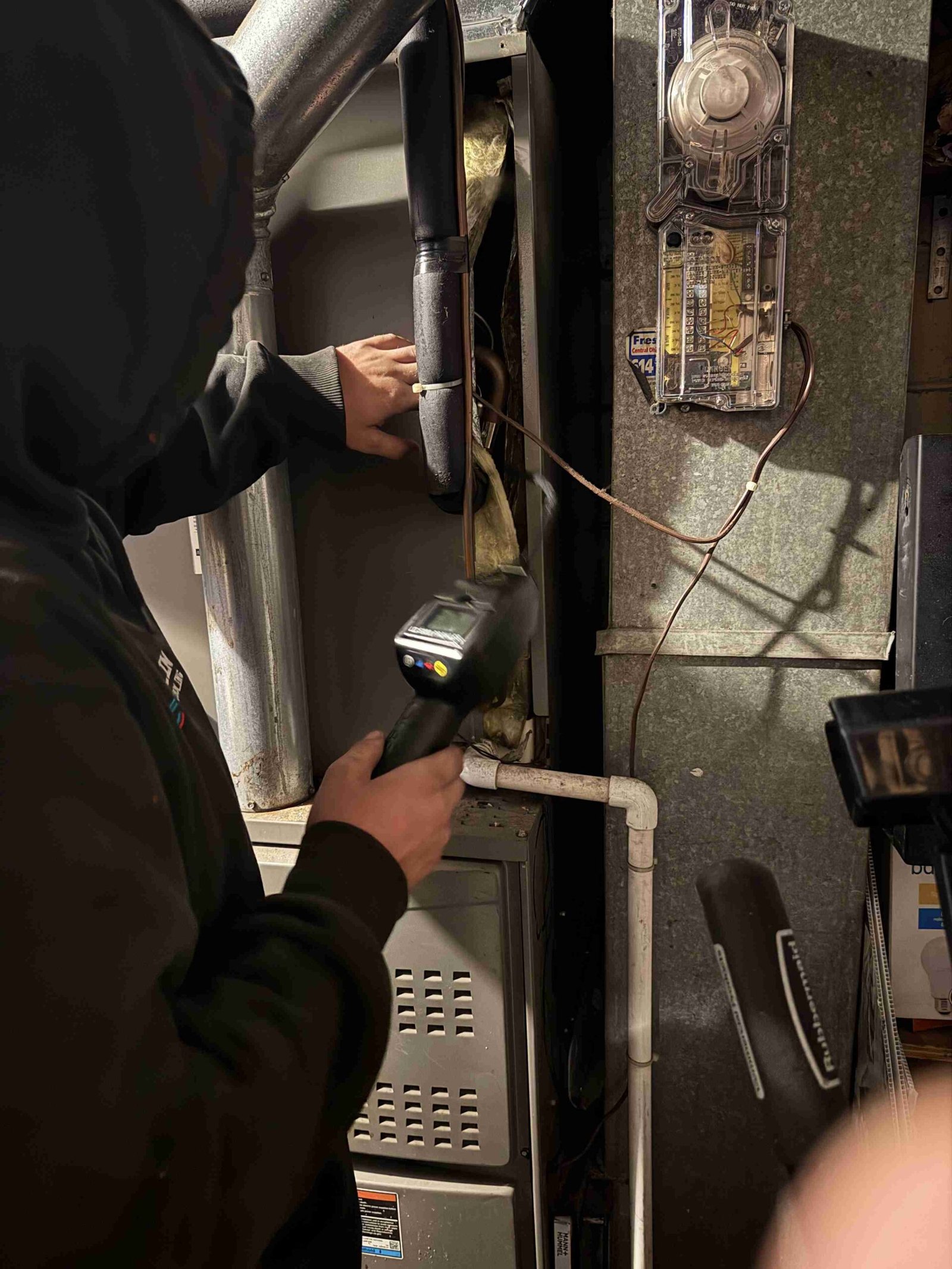 Franklin technician inspecting a heating system