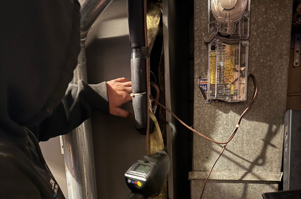 Technician checking furnace components — Franklin Heating Cooling and Refrigeration furnace repair services in Powell, OH. Furnace repair near me