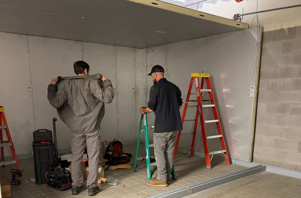 Franklin Heating Cooling and Refrigeration technicians installing walk-in cooler panels for HVAC contractor services in Powell, OH. HVAC contractor near me.