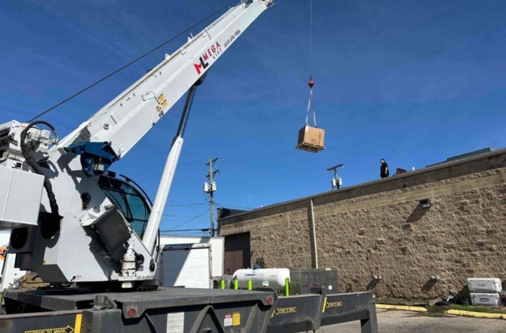 Franklin Heating Cooling and Refrigeration crane supporting commercial HVAC installation for HVAC contractor services in Dublin, OH. HVAC contractor near me.