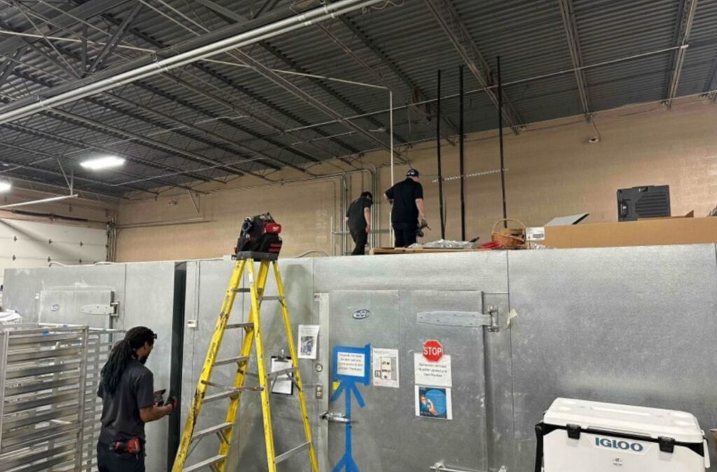 Franklin Heating Cooling and Refrigeration technicians working on overhead commercial equipment for HVAC contractor services in Sunbury, OH. HVAC contractor near me.
