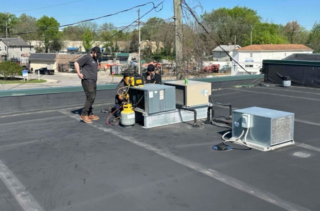 Franklin Heating Cooling and Refrigeration technicians servicing rooftop HVAC units for HVAC contractor services in Lancaster, OH. HVAC contractor near me.